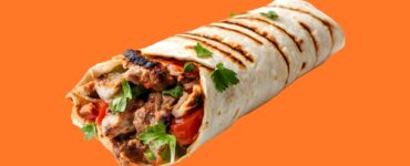 Entrepreneur preparing shawarma at a small grill spot in Nigeria showing how to start a shawarma business with low capital