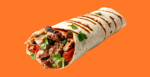 Entrepreneur preparing shawarma at a small grill spot in Nigeria showing how to start a shawarma business with low capital