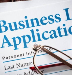 Business owner applying for a business loan in Nigeria in 2026 with documents and bank approval