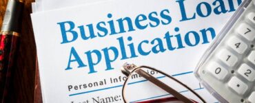 Business owner applying for a business loan in Nigeria in 2026 with documents and bank approval