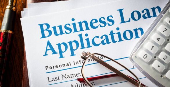 Business owner applying for a business loan in Nigeria in 2026 with documents and bank approval