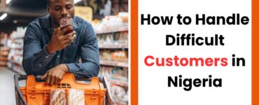 Nigerian startup founder handling a difficult customer professionally in a business setting